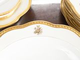 a lot of plates that are sitting on a table