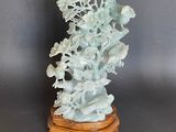 chinese carved jade figurine of flowers and leaves on a stand