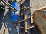 an old rusted motorcycle sitting on the side of the road