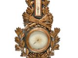 a clock hanging on the side of a wall