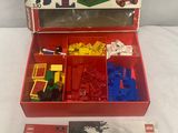 an open box of legos with a picture of a man and a woman
