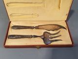 a wooden box with a set of silverware in it