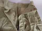 a close up of a pair of pants with buttons on them