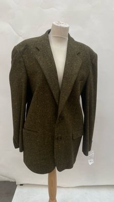 an image of a suit on a mannequin stand