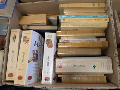 a box full of books that are sitting on the floor