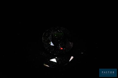 an image of a glass with a red fish inside of it