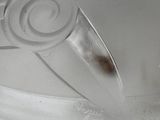 a clear plastic plate with a star design on it