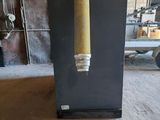 an image of a black refrigerator with a yellow venter hanging from it ' s side