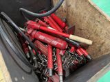 a bucket full of tools that are sitting in it