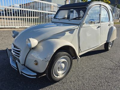 a small car that is parked in the parking lot