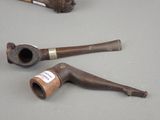 a pipe and a pipe holder on a table