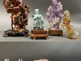 several figurines of different shapes and sizes are displayed on a table