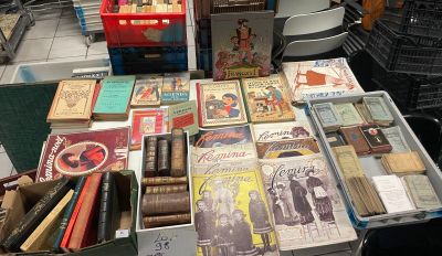 a table with a lot of old books on it
