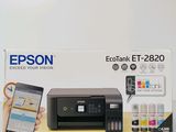 a box with a printer and a cell phone in it