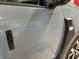 a close up of a car door with a sticker on it