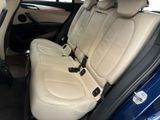 the back seats of a blue car are clean and ready to be used