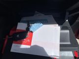 a bunch of mail and a car key in the back of a car