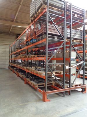 a large rack with many items in it in a warehouse
