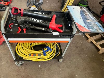 a work bench with tools on it in a garage