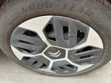 a close up of a tire on a car ' s rim
