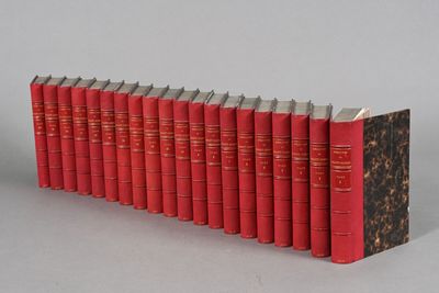 books lined up in a row on a gray surface
