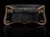 an image of a black leather wallet with a gold clasp