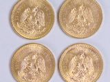 four gold coins with the image of a man and a woman on them