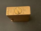 a gold bar that is sitting on a table