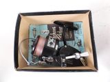 a box that has a fishing reel and a fishing line in it