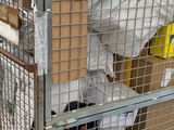 a metal cage with a bunch of boxes on top of it
