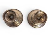 pair of antique brass door knobs on white background