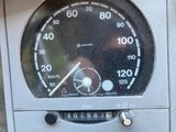 a close up of a speedometer on the side of a building