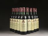 six bottles of wine are lined up in a row on a table
