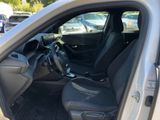 the interior of a car with the door open showing the driver ' s seat