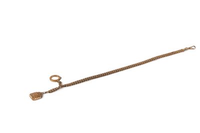 an image of a gold chain with a bell on it