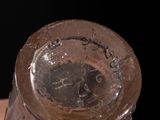 a close up view of a glass bottle on a table
