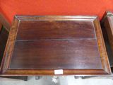 a wooden tray that is sitting on top of a table