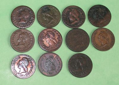 a lot of coins that are on a green surface