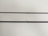 a pair of fishing rods hanging on a wall