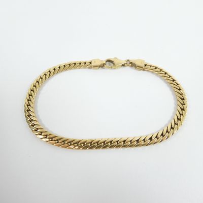 a gold bracelet with a braid design on a white background