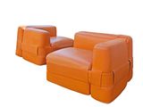 pair of orange leather lounge chairs on a white background