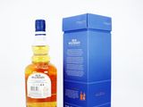 an image of a bottle of whisky next to a blue box