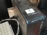 a computer with a keyboard and a mouse on a desk