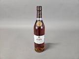 an image of a bottle of wine sitting on top of a table