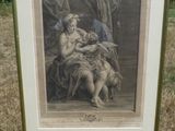 an old picture of a woman holding a child in her lap