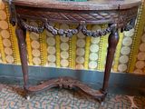 a wooden table with a lamp on top of it
