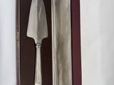 a knife in a case that is open on the table