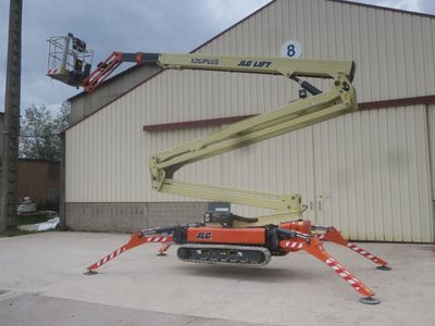 a picture of a man on a cherry picker in front of a building