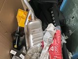 a cardboard box filled with luggage and other items