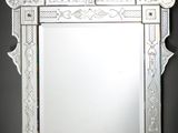 a mirror that is hanging on the wall in the room